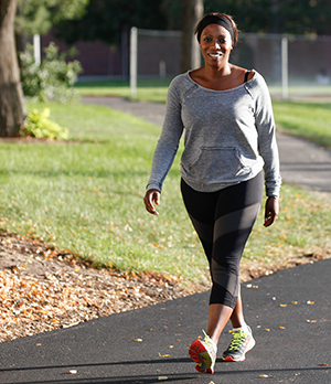 Woman walking in park.