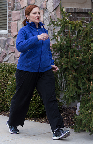 Woman walking outdoors.