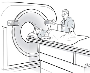 Boy lying on back on scanner table. Healthcare provider is preparing table to go into ring-shaped opening.